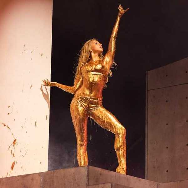Tate McRae closes out her set covered in gold paint performing “Sports Car” during her headlining set at Lollapalooza in Grant Park on Aug. 2, 2026, in Chicago.