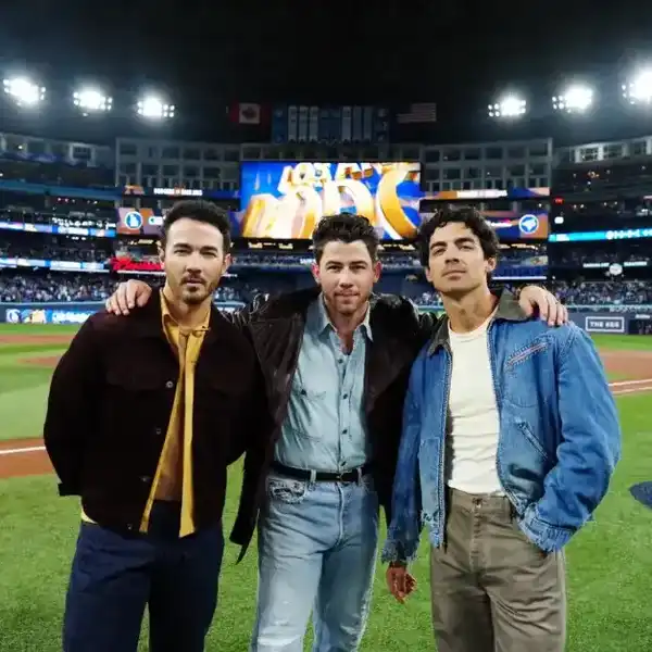 The Jonas Brothers look on prior to Game Two of the 2025 World Series presented by Capital One between the Los Angeles Dodgers and the Toronto Blue Jays at Rogers Centre on Saturday, October 25, 2025 in Toronto, Ontario, Canada.