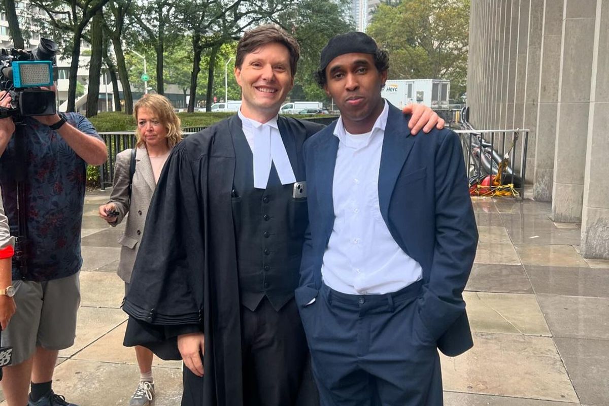 Top5 (right) with his lawyer Gary Grill.