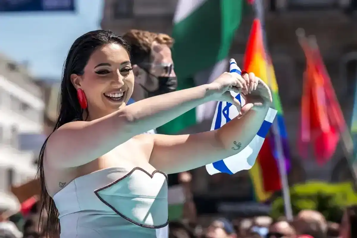 Yuval Raphael representing Israel with the song "New Day Will Rise" walks on the turquoise carpet next to the Basel Town Hall during the opening ceremony of the Eurovision Song Contest 2025 in Basel on May 11, 2025.